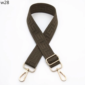Detail of adjustable coffee brown jacquard strap with gold hooks and geometric pattern