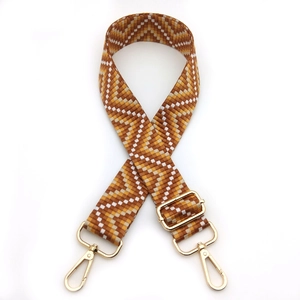 Adjustable chevron patterned woven shoulder strap with gold metal lobster clasps for handbags