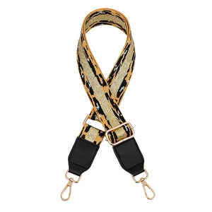 Detail of adjustable leopard print bag strap with gold sequins and metallic hooks