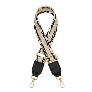 Adjustable leopard print bag strap with gold glitter stripe and polished metal hardware