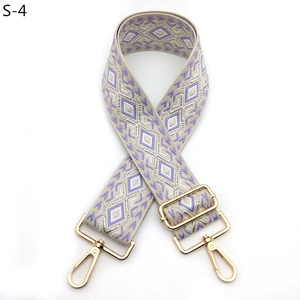 Detail of purple and grey geometric woven strap with polished gold-tone metal hooks