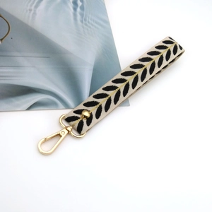 Beige leaf embroidery wristlet strap with gold clasp for keys and handbags
