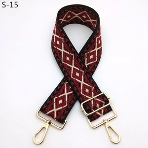Close-up of diamond pattern woven replacement strap with polished gold metal buckles