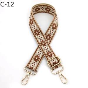 Close-up of vintage geometric weave strap with gold metal buckles and lobster clasps