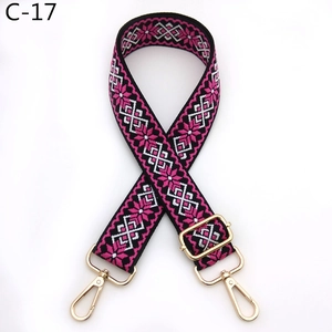 Close-up of bohemian star pattern woven shoulder strap with gold metal lobster clasps