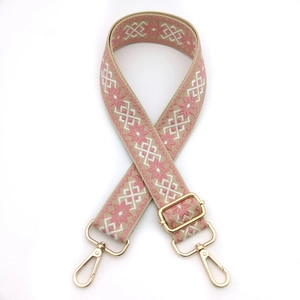 Adjustable woven canvas shoulder strap with pink and beige diamond patterns and gold buckles