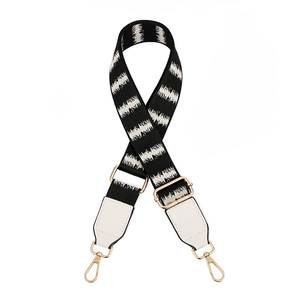 Adjustable crossbody bag strap with black and white geometric wave pattern and gold hooks