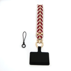 Embroidered leaf pattern wrist strap with gold heart carabiner and phone connector pad