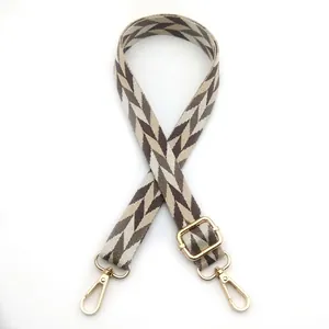 Close-up of style 9 brown leaf chevron woven strap with golden lobster clasps