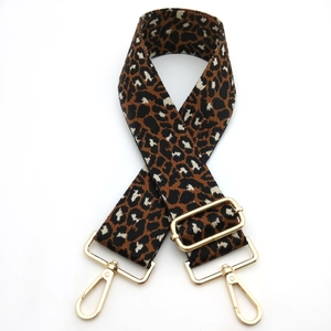 Adjustable leopard print bag strap with gold metal buckles and wide cross-body design