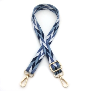 Adjustable woven shoulder strap for bags with blue leaf pattern and gold hardware