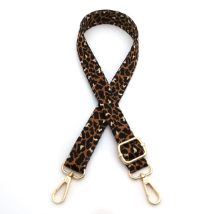 Adjustable leopard print jacquard bag strap with gold metal hooks on white background