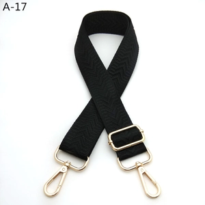 Adjustable black herringbone woven shoulder strap with gold metal lobster clasps