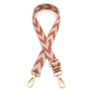 Adjustable chevron canvas bag strap with red and white pattern and gold metal hooks