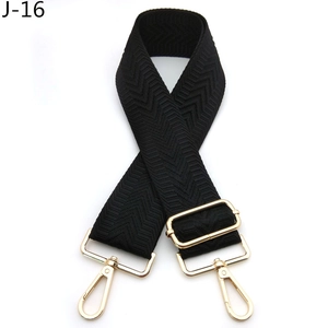 Detail of black chevron woven nylon replacement strap with gold lobster clasps and buckles