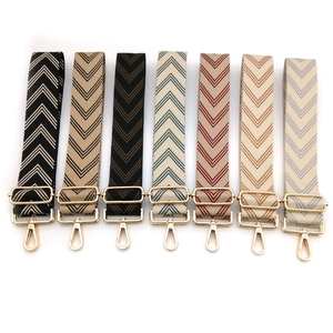 Adjustable wide replacement bag strap with herringbone arrow pattern and gold metal hooks