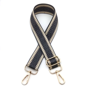 Adjustable wide woven shoulder strap with black and beige chevron pattern and gold hooks