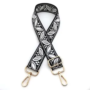 Detail of Style 4 adjustable woven strap with grey leaf embroidery and gold hardware