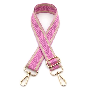 Adjustable chevron patterned bag strap with gold metal lobster clasps and pink accents