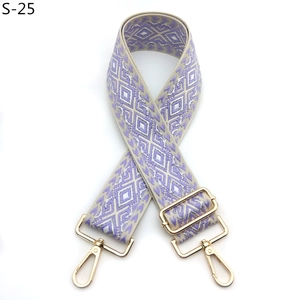 Detail of lavender and silver geometric jacquard strap with gold-plated metal hooks
