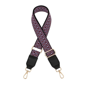 Close-up of adjustable woven shoulder strap with gold alloy hooks and black leather ends