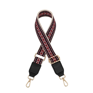 Adjustable woven purse strap with red blue ethnic pattern and gold metal hooks