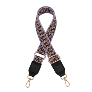 Close-up of adjustable lavender woven shoulder strap with gold-tone metal hooks
