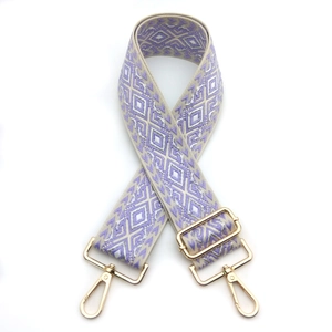 Adjustable wide woven shoulder strap with purple and beige geometric diamond patterns
