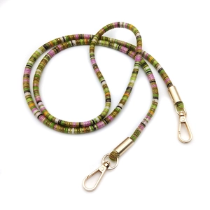 Ethnic style colorful phone lanyard with golden lobster clasps on a white background