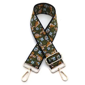 Ethnic style olive green bag strap with colorful floral embroidery and gold metal clasps