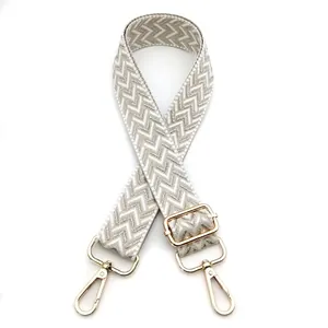 Adjustable grey and white herringbone woven strap with light gold lobster clasps