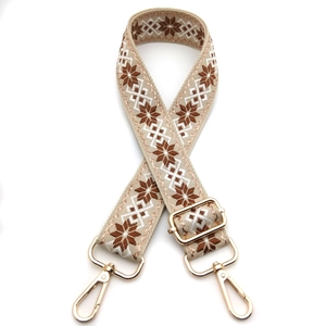 Ethnic style embroidered bag strap with beige geometric patterns and gold metal buckles