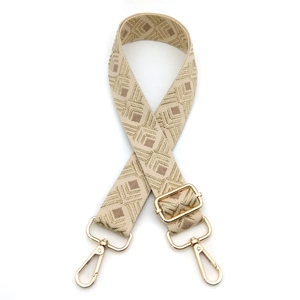 Adjustable beige woven shoulder strap with gold geometric pattern and lobster clasps