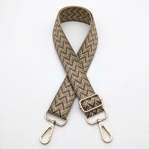 Detail view of 3.8cm wide woven bag strap No. 8 with herringbone pattern and gold hardware