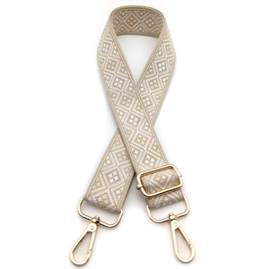 Adjustable beige and white geometric diamond pattern shoulder strap with gold metal hooks