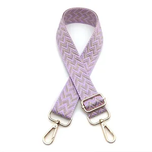 Detail view of purple and gold chevron patterned 3.8cm wide adjustable bag shoulder strap
