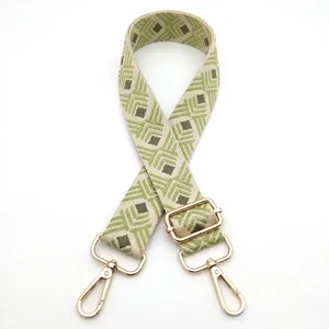 Adjustable guitar-style wide shoulder strap with green geometric diamond pattern and gold hooks
