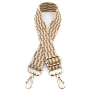 Detail of No. 25 beige and coffee checkered wide bag strap with gold metal hooks