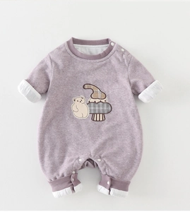Detailed view of lavender baby romper with cute bear embroidery and snap buttons