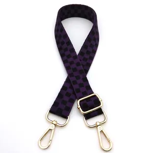 Adjustable purple and black checkered bag strap with gold rotating metal hooks