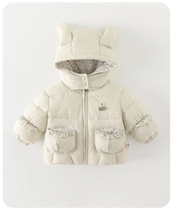 Close-up of baby winter jacket hood with bunny ears and delicate floral lining details