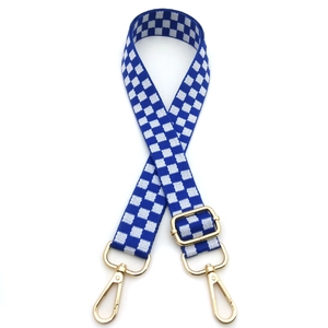 Adjustable checkerboard pattern bag strap with blue and white weave and gold hardware