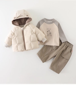 Detail of baby boy 3-piece winter set with quilted hooded jacket and cartoon tee