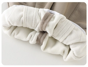 Close-up of thick warm lamb wool lining and sturdy stitching on toddler winter coat