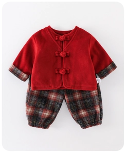 Flat lay of red fleece toddler set with Chinese frog buttons and plaid pants