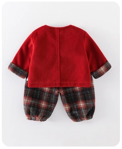 Detailed view of red fleece top and plaid pants for baby girls winter outfit set