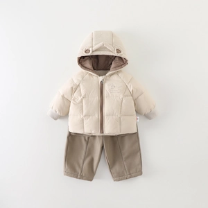 Winter toddler outfit featuring beige hooded padded jacket with ears and brown pants