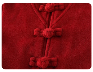 Close-up of traditional Chinese red wool fabric with handmade fabric frog buttons