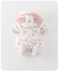 Detailed close-up of hooded baby winter romper with cute bunny ear design and soft fabric