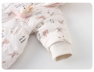 Detail of baby quilted down suit with 3D plush bunny and Love You BUNNY print embroidery